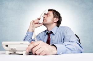frustrated man on hold